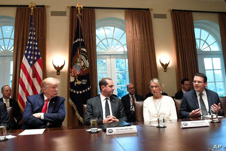 President Donald Trump, second from left, listens to American Vaping Association President Greg Conley, right, during a meeting…