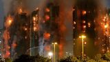 At least 13 dead in fire in Hong Kong high-rise apartment buildings