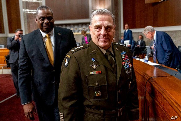 Secretary of Defense Lloyd Austin, left, and Chairman of the Joint Chiefs of Staff Gen. Mark Milley, right, arrive for a Senate…