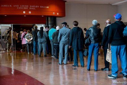 Mourners wait in line for the public viewing of late U.S. Congressman Elijah Cummings at Morgan State University in Baltimore,…
