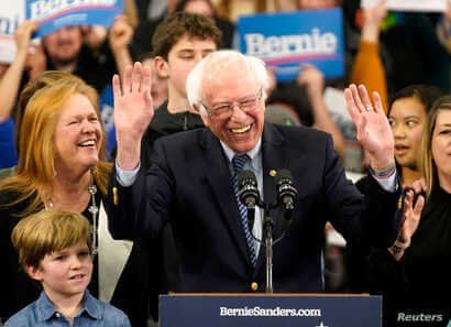 Presidential candidate Senator Bernie Sanders is accompanied by his wife Jane O’Meara Sanders and other relatives as he speaks at his New Hampshire primary night rally in Manchester.