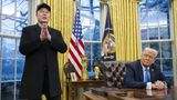 Trump, with Musk nearby, signs order forcing agencies to work with DOGE, to reduce labor force