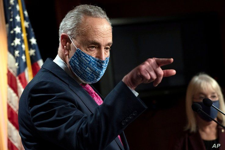 Senate Majority Leader Chuck Schumer of N.Y., left, speaks during a news conference with Sen. Patty Murray, D-Wash., right,…