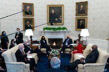 President Joe Biden, accompanied by Vice President Kamala Harris, speaks with House Speaker Nancy Pelosi and House Majority…