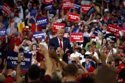 President Donald Trump reacts to the crowd after speaking during his re-election kickoff rally at the Amway Center, Tuesday, June 18, 2019, in Orlando, fla. 