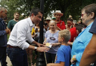 Democratic presidential candidate South Bend Mayor Pete Buttigieg meets with people at a campaign event, Thursday, Aug. 15,…