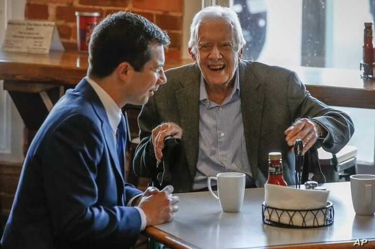 Democratic presidential candidate former South Bend, Ind., Mayor Pete Buttigieg, left, meets with former President Jimmy Carter…