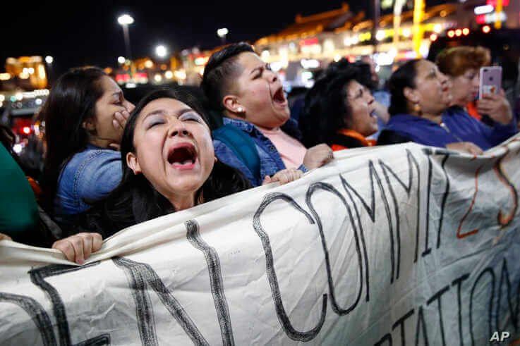 Protesters chant outside a campaign event for Democratic presidential candidate, former Vice President Joe Biden