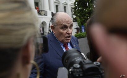 FILE - President Donald Trump's lawyer Rudy Giuliani speaks to reporter's on the South Lawn of the White House in Washington, May 30, 2018. 