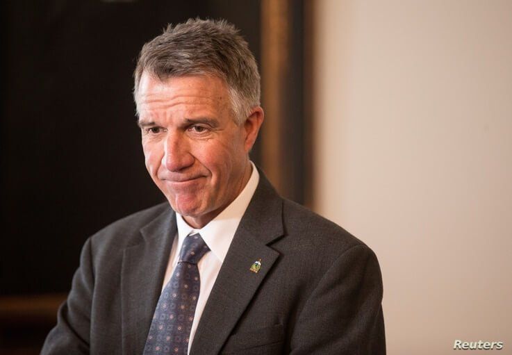 FILE - Vermont Gov. Phil Scott speaks to reporters in his offices at the State Legislature in Montpelier, March 13, 2018.