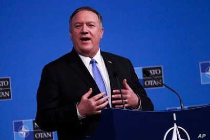 U.S. Secretary of State Mike Pompeo talks to journalists during a news conference during a NATO Foreign Ministers meeting at…