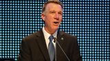 Vermont Republican Governor Scott signs voting expansion law