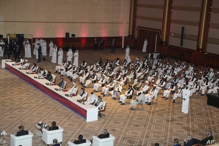 Taliban delegation attend the opening session of the peace talks between the Afghan government and the Taliban in Doha, Qatar,…