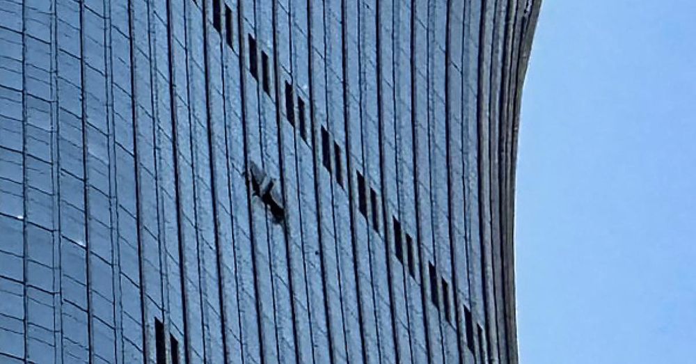 Small plane crashes into Beijing skyscraper, leaving visible hole in upper floors