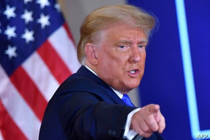 US President Donald Trump gestures after speaking during election night in the East Room of the White House in Washington, DC,…