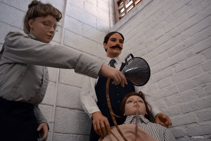 Wax statues at at the Occoquan Workhouse Museum in Lorton, Virginia, show the 1917 force-feeding of suffragist Lucy Burns, an American women's rights advocate who was on hunger strike. (Photo by Diaa Bekheet)