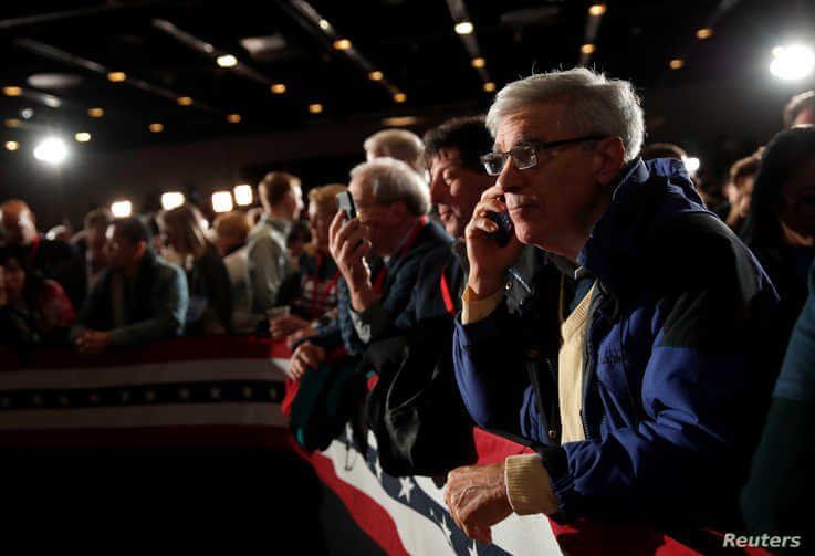 Supporters of Democratic presidential candidate and former Vice President Joe Biden participate at a rally in Iowa