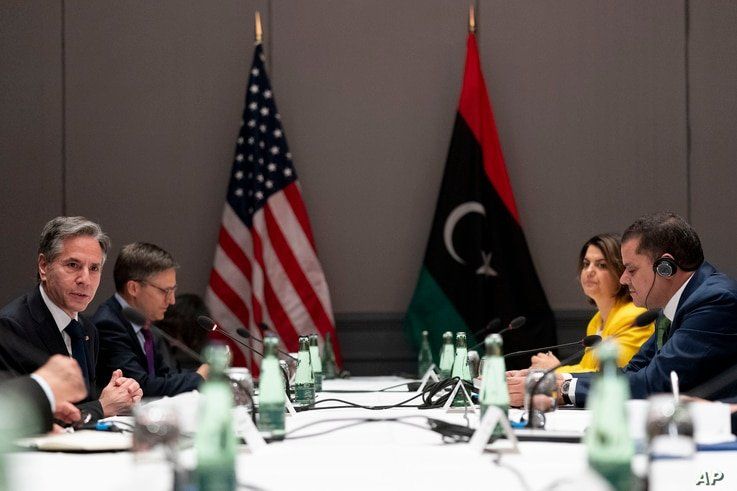 U.S. Secretary of State Antony Blinken, left, speaks as he meets with Libyan Prime Minister Abdulhamid Dbeibeh, right