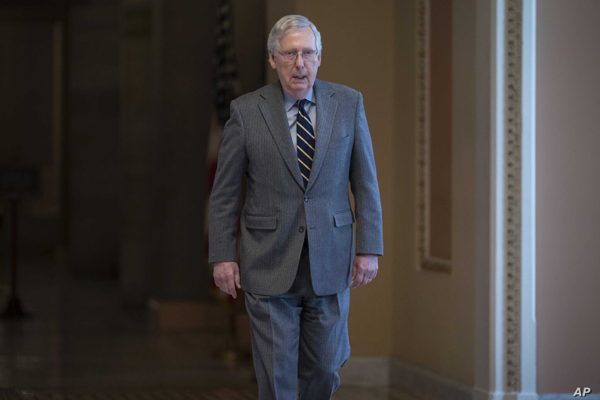 Senate Majority Leader Mitch McConnell, R-Ky., walks to the chamber for a vote on a measure to help tackle the coronavirus…