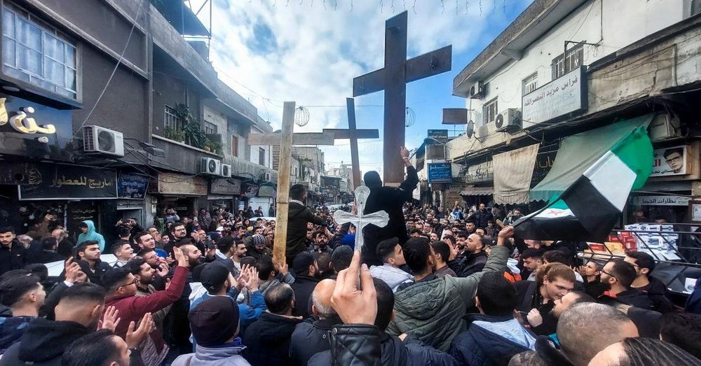 Syrian Christians protest in Damascus after arsonists torch Christmas tree