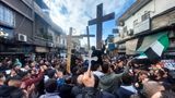 Syrian Christians protest in Damascus after arsonists torch Christmas tree