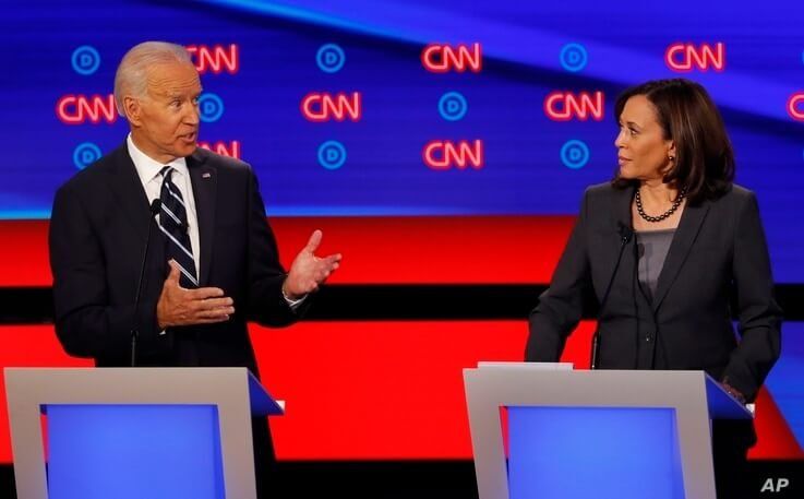 Sen. Kamala Harris, D-Calif., listens as former Vice President Joe Biden speaks during the second of two Democratic presidential primary debates hosted by CNN, July 31, 2019, in the Fox Theatre in Detroit.