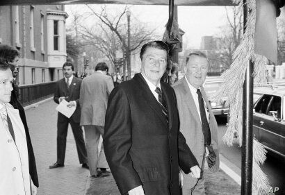 President elect Ronald Reagan and his transition team leader Edwin Meese leave the Blair House in Washington December 10, 1980,…