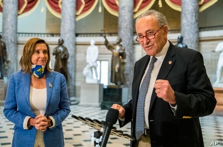 Senate Minority Leader Chuck Schumer of N.Y., with House Speaker Nancy Pelosi of Calif., speaks to reporters following a…