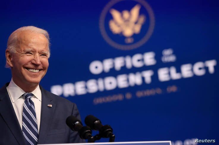 U.S. President-elect Joe Biden smiles as he speaks about health care and the Affordable Care Act (Obamacare) at the theater…