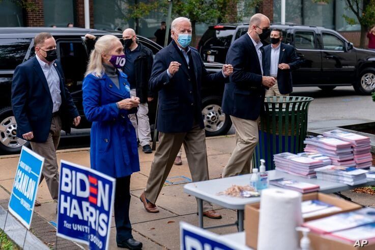 Democratic presidential candidate former Vice President Joe Biden arrives to speak with supporters outside a voter service center, in Chester, Pennsylvania, Oct. 26, 2020.