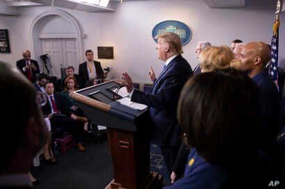 President Donald Trump speaks during a briefing about the coronavirus in the James Brady Press Briefing Room of the White House, Sunday, March 15, 2020, in Washington.