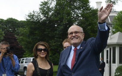 President Donald Trump's lawyer Rudy Giuliani waves as he attends the White House Sports and Fitness Day event on the South Lawn