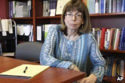 Margaret Stock, an Alaska-based immigration attorney and a retired Army Reserve lieutenant colonel who helped create the immigrant recruitment program, poses at her office in Anchorage, Alaska, July 3, 2018.