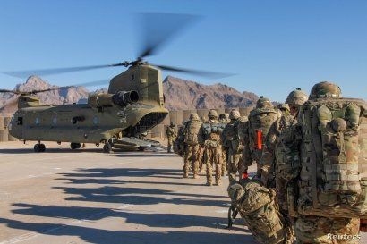 U.S. soldiers attached to the 101st Resolute Support Sustainment Brigade, Iowa National Guard and 10th Mountain, 2-14 Infantry Battalion, load onto a Chinook helicopter to head out on a mission in Afghanistan, Jan. 15, 2019. 
