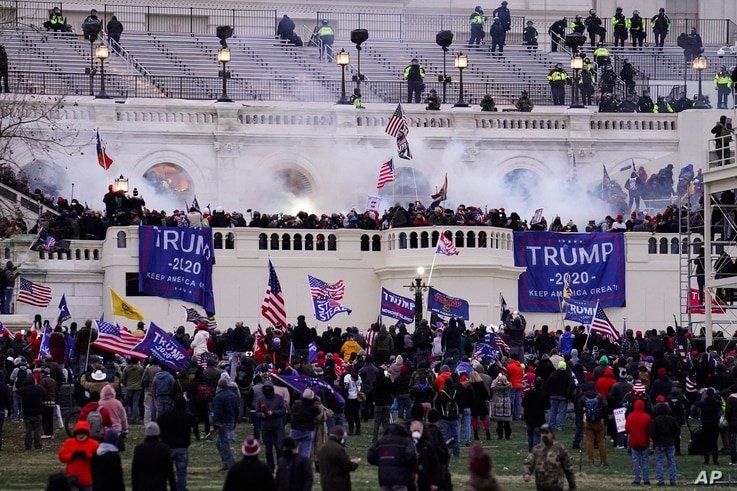 FILE - In this Wednesday, Jan. 6, 2021, file photo, rioters storm the Capitol, in Washington. Capitol Police say they have…