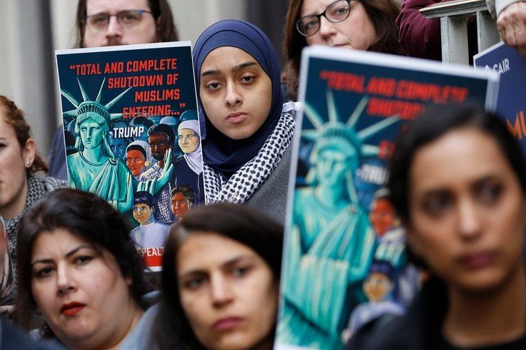 Demonstrators listen to speakers during a rally outside the U.S. 4th Circuit Court of Appeals Tuesday Jan 28, 2020, in Richmond…