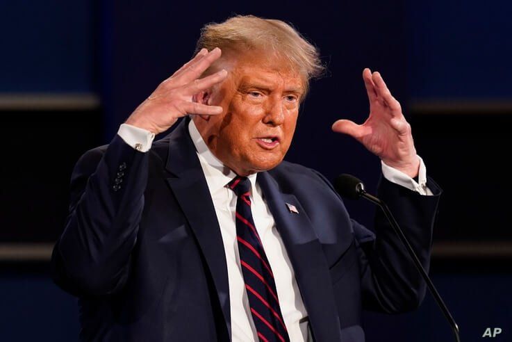 President Donald Trump gestures while speaking during the first presidential debate Tuesday, Sept. 29, 2020, at Case Western…