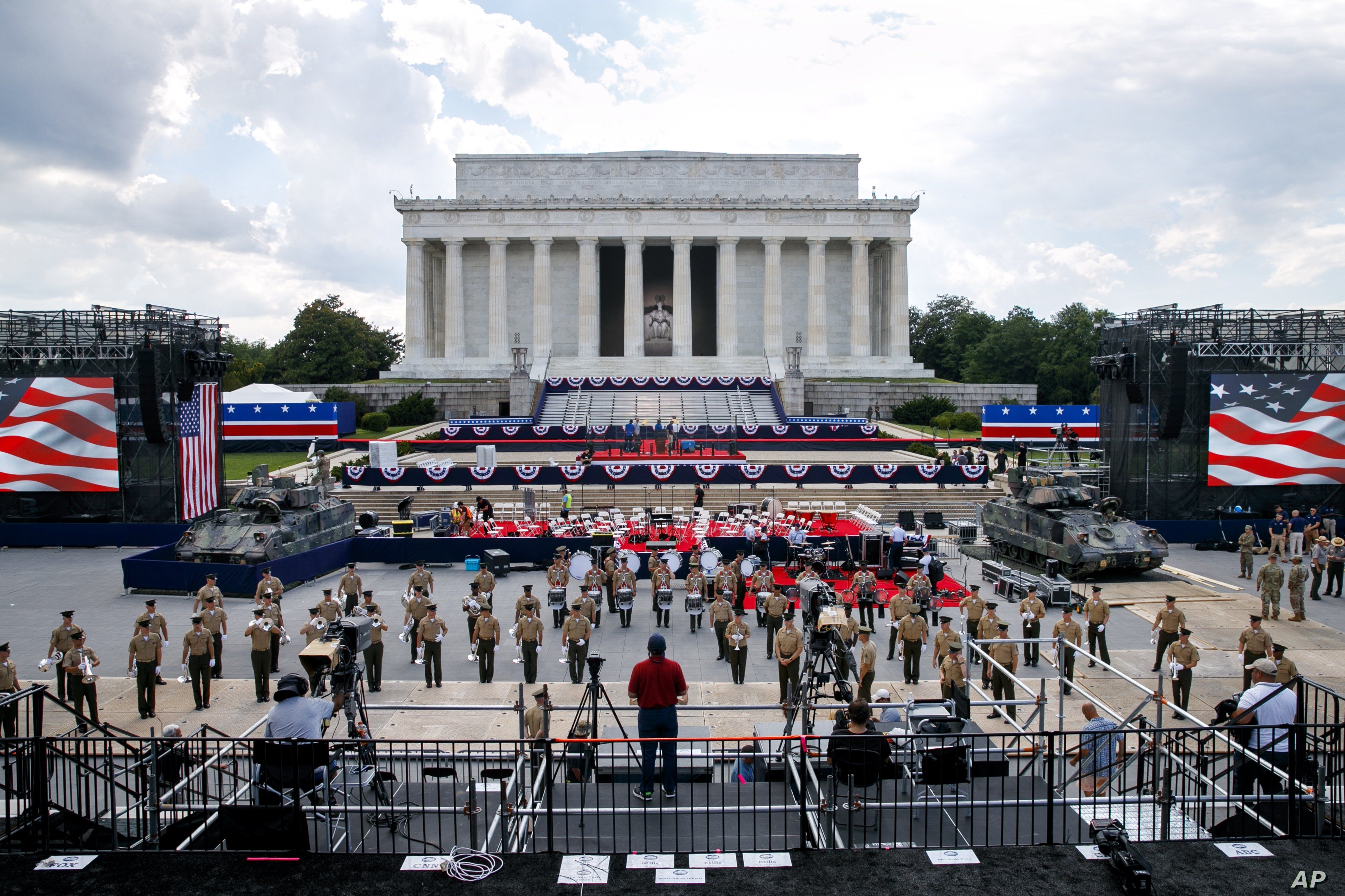 Two Bradley Fighting Vehicles flank the stage being prepared in front of the Lincoln Memorial, Wednesday, July 3, 2019, in Washington, ahead of planned Fourth of July festivities with President Donald Trump. 