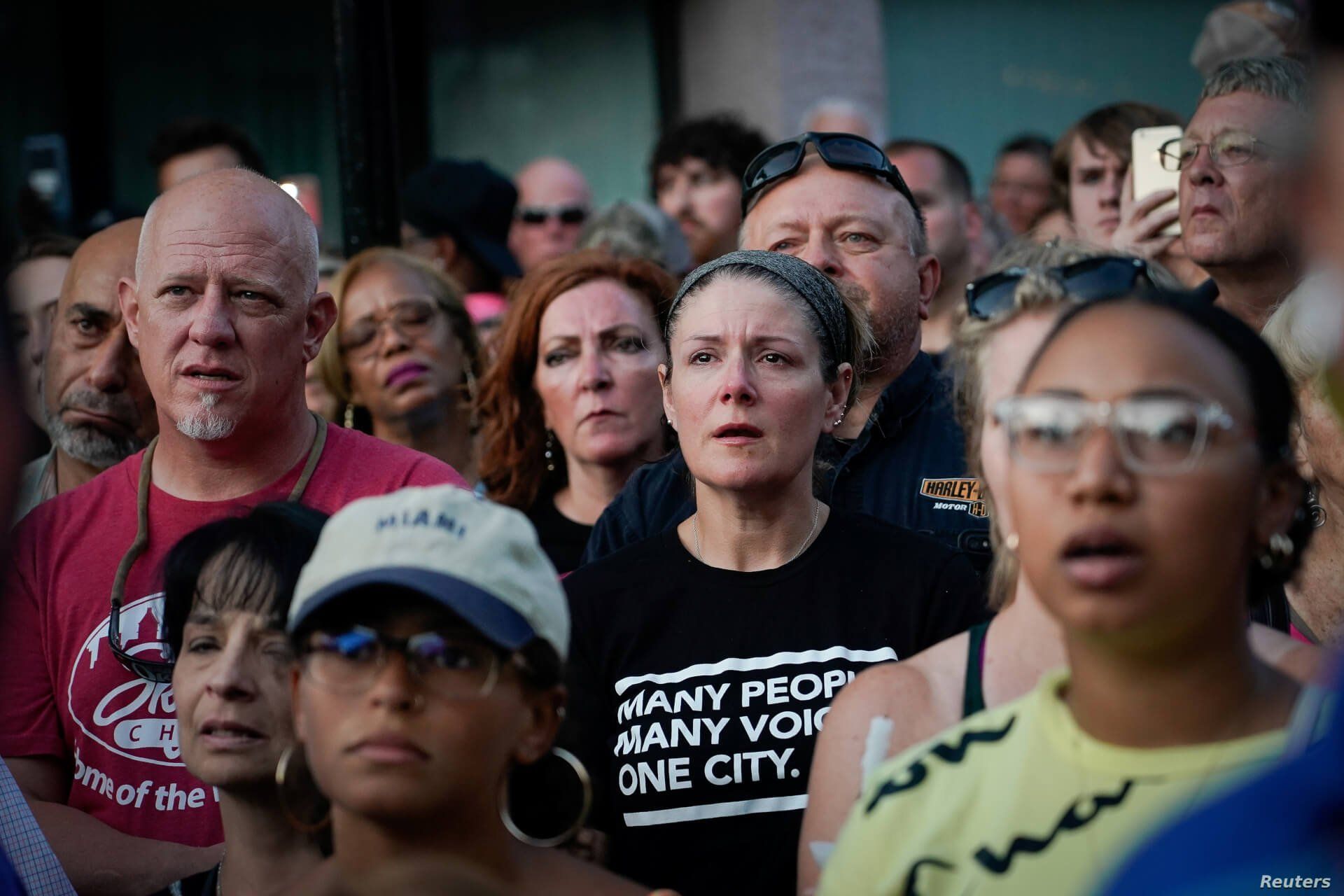 Mourners attend a vigil at the scene after a mass shooting in Dayton, Ohio, Aug. 4, 2019