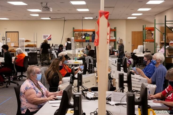 Early voting and absentee ballots are processed ahead of the upcoming presidential election in Tucson, Arizona, Oct. 31, 2020. 