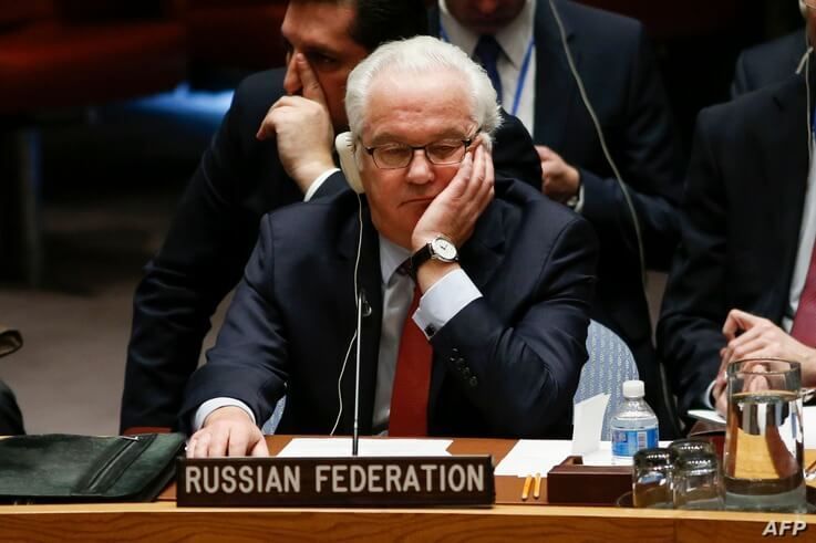 Russian Ambassador to the UN Vitaly Churkin listens at the UN Security Council which voted on a Russian-Turkish peace plan for…