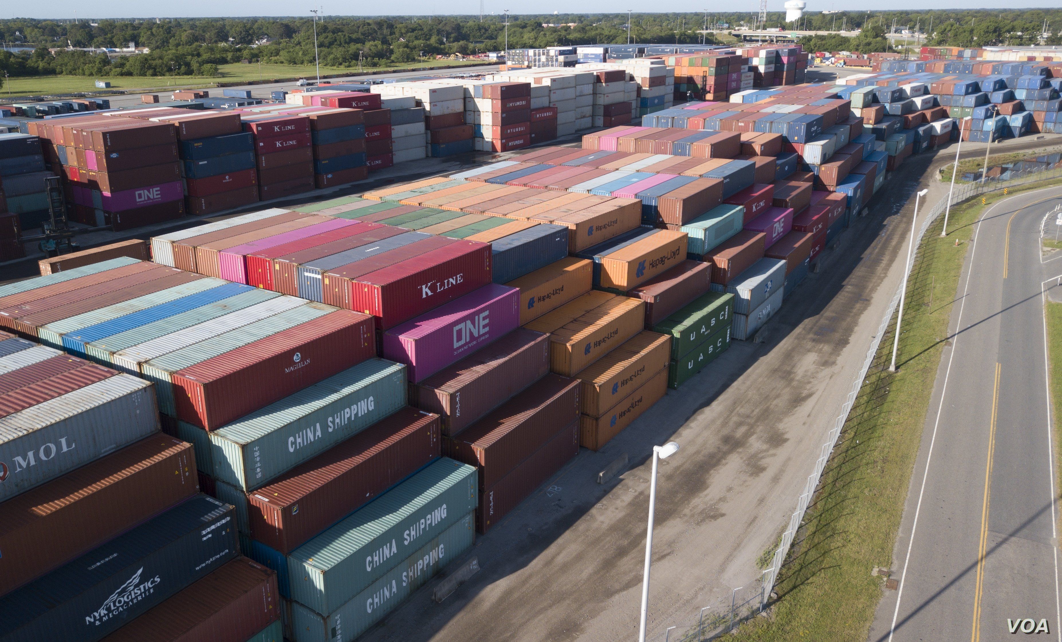 China Shipping Company and other containers are stacked at the Virginia International's terminal in Portsmouth, Va., May 10, 2019. 