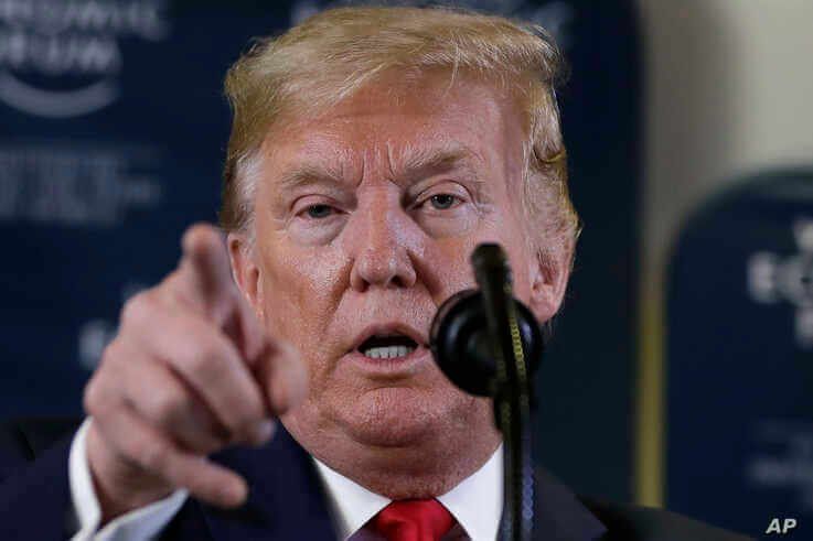 FILE - In this Jan. 22, 2020, file photo, President Donald Trump speaks during a news conference at the World Economic Forum in…