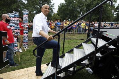 Democratic presidential candidate Sen. Cory Booker waits to speak at the Polk County Democrats Steak Fry, Saturday, Sept. 21, 2019, in Des Moines, Iowa. (AP Photo/Charlie Neibergall)