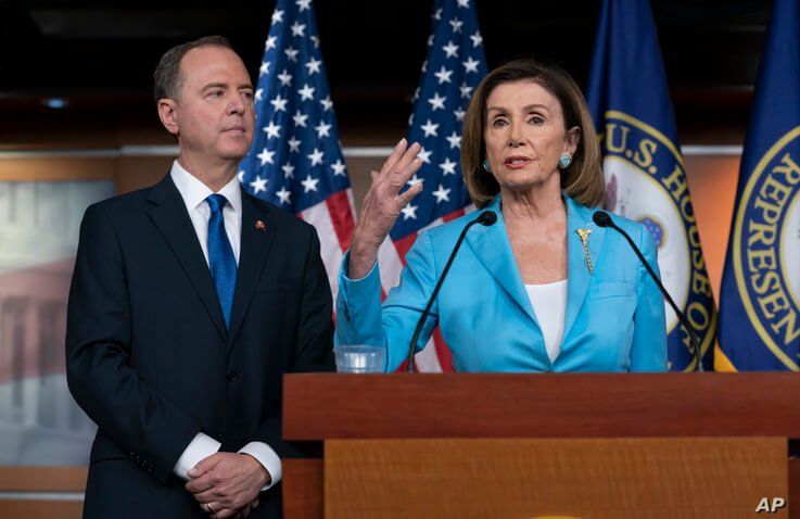 FILE - Speaker of the House Nancy Pelosi is joined by House Intelligence Committee Chairman Adam Schiff at a news conference as House Democrats move ahead in the impeachment inquiry of President Donald Trump, at the Capitol, in Washington, Oct. 2, 2019. 