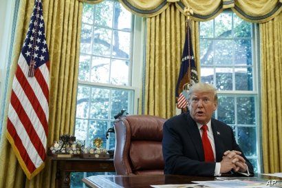 FILE - President Donald Trump talks with reporters in the Oval Office of the White House, Sept. 4, 2019.