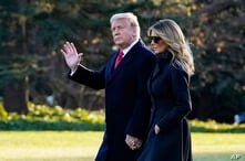 President Donald Trump and first lady Melania Trump walk to board Marine One on the South Lawn of the White House, Dec. 23, 2020, in Washington.