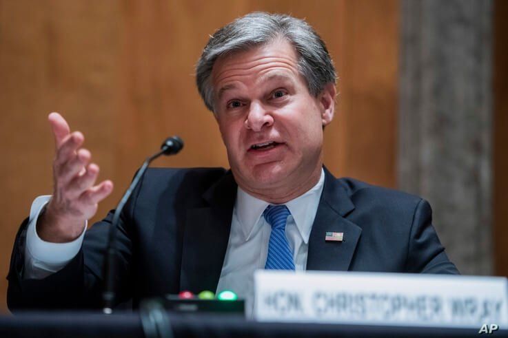 FBI Director Christopher Wray testifies during a Senate Homeland Security and Governmental Affairs Committee hearing on …
