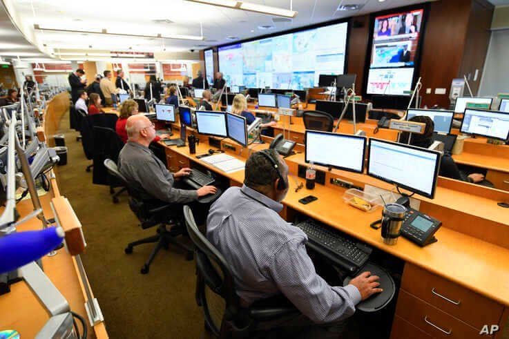 FILE - Personnel at the The Centers for Disease Control and Prevention (CDC) work the Emergency Operations Center in response to the coronavirus, among other threats, Feb. 13, 2020, in Atlanta, Georgia.