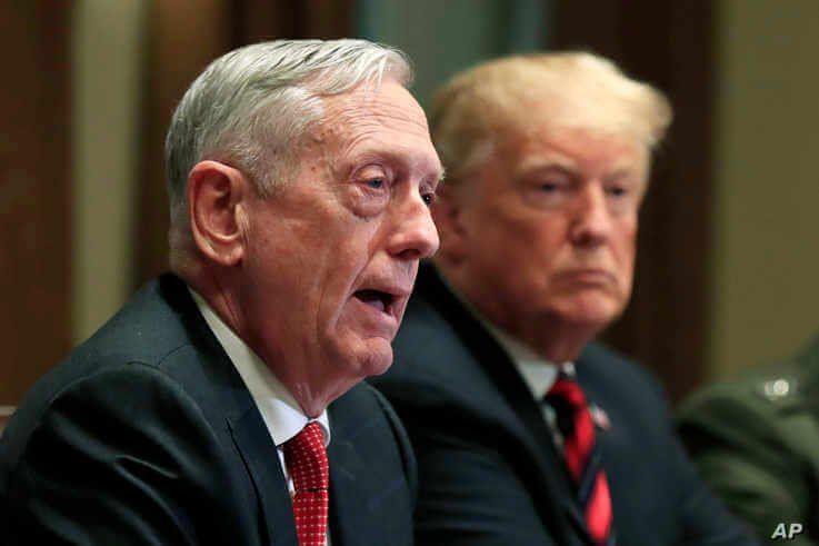 Then-Defense Secretary Jim Mattis speaks beside President Donald Trump, during a briefing in the Cabinet Room at the White House in Washington, Oct. 23, 2018.